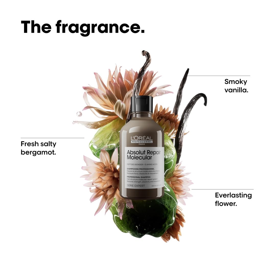 L'Oreal hair product bottle surrounded by flowers and labeled with fragrance notes on a white background.