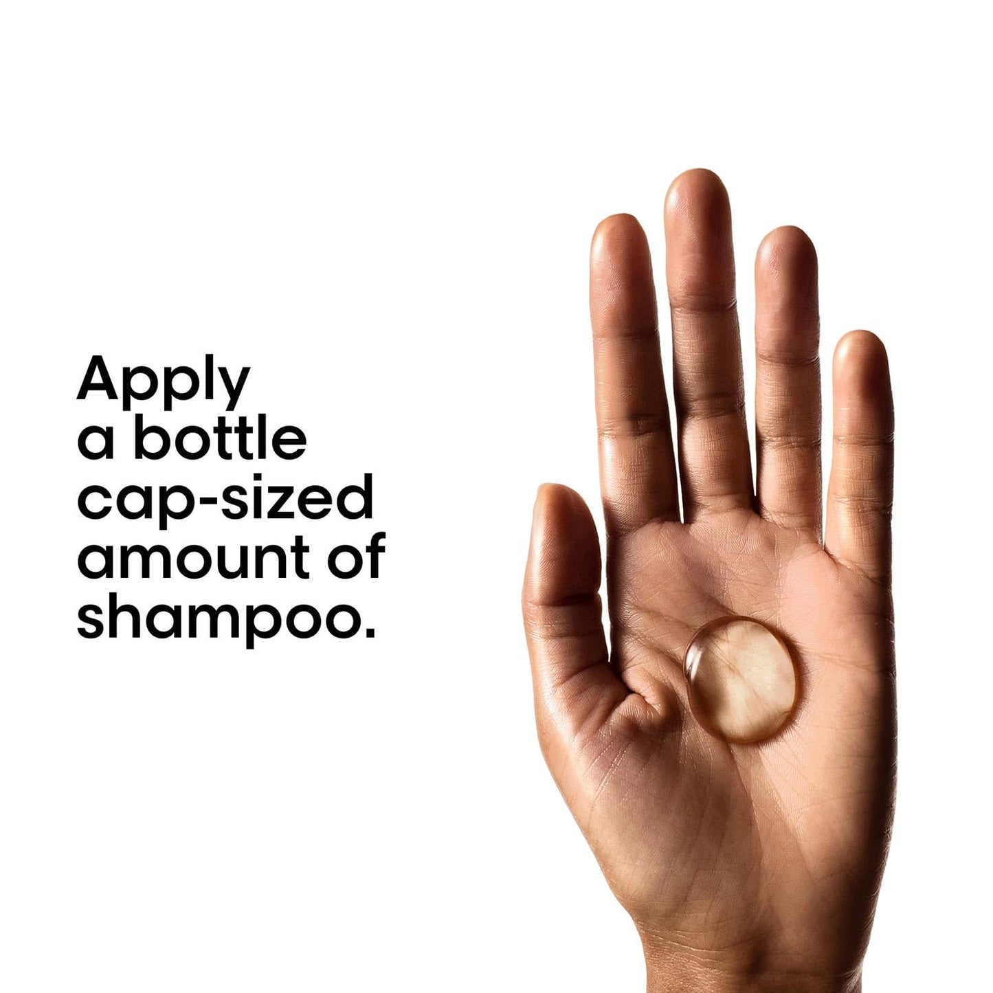 Hand holding a small amount of shampoo with text on a white background